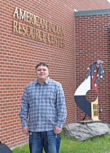 Theron Granbois, who graduated from BSU in December with degrees in business administration and accounting, will celebrate the first commencement ceremony of his life Friday at the Sanford Center. (Jillian Gandsey | Bemidji Pioneer)