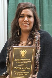 Senior Andrea Goodwin with her plaque for Outstanding American Indian Student of the Year