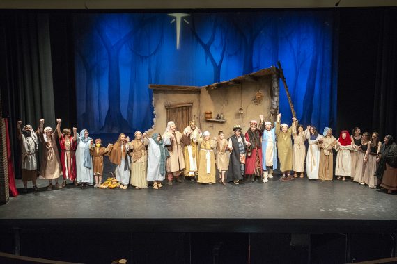 Cast of “Ahmal and the Night Visitors” on stage taking a bow