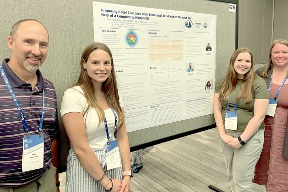 BSU Noyce Scholars Julia Petrich and Kaitlynn Capistrant presented their research at the annual Robert Noyce Conference in Washington D.C. They are joined by Dr. Todd Frauenholtz (far left) and Dr. Jenna O’Dell (far right)