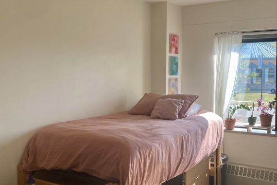 Birch unlofted bed raised to the tallest rung so dresser drawers can fit underneath.